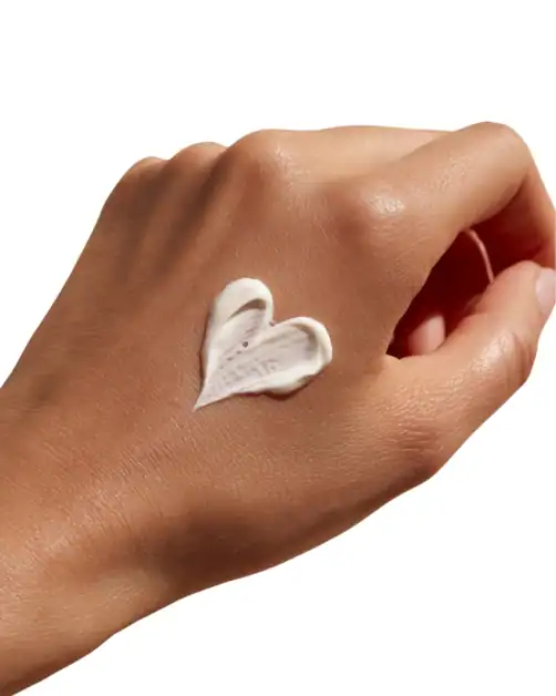 Applying body lotion as part of daily skincare routine