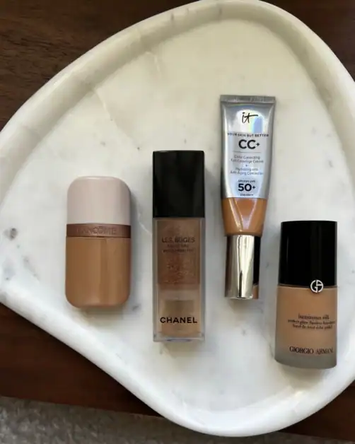 Picture of different light-weight to more coverage foundations on a marble table