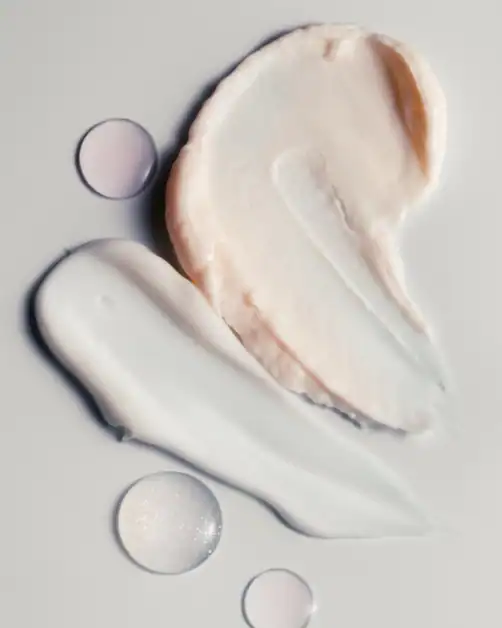 Picture of different niacinamide product formats. Moisturizer, serum, toner.