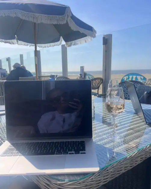 Working on Glowhaven blog on a laptop by the beach