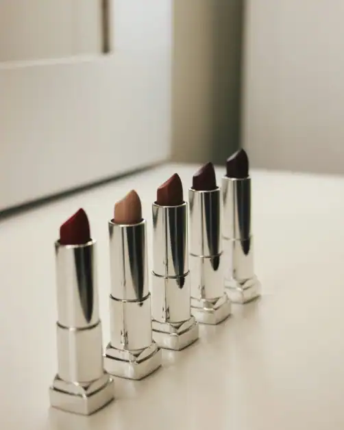 Different lipstick shades lined up showing how to choose the right lipstick for your undertone