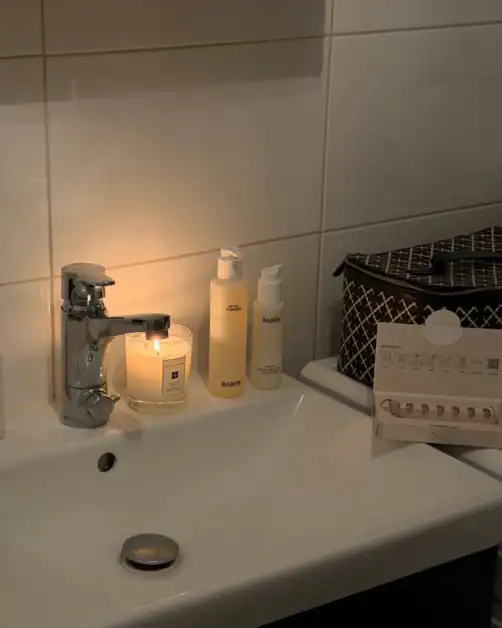 Evening skincare by the bathroom sink